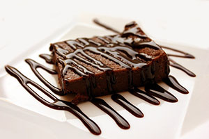 Chocolate brownie slices arranged on a plate